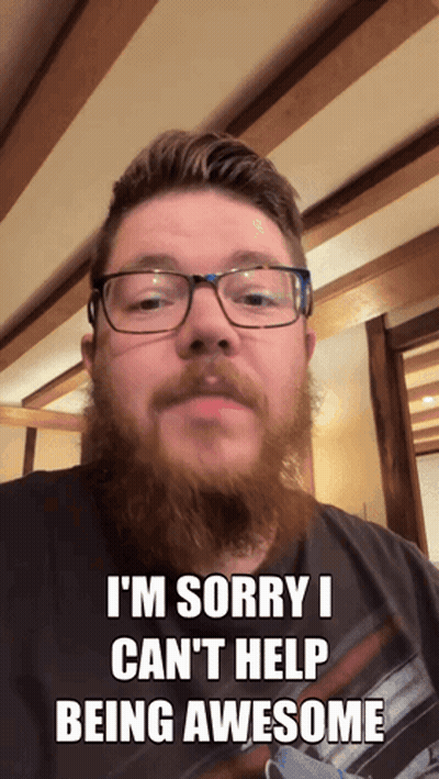 A Man With Glasses And A Beard Says Sorry I Can 'T Help Being Awesome GIF