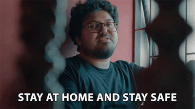A Man With Glasses And A Beard Says Stay At Home And Stay Safe GIF