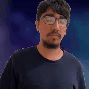 A Man With Glasses And A Beard Scratching His Head GIF