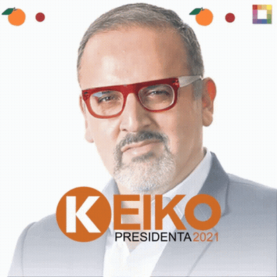 A Man With Glasses And A Beard Stands In Front Of A Sign That Says Keiko GIF