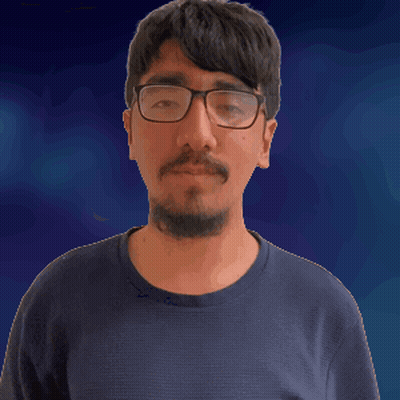 A Man With Glasses And A Beard Sticks Out His Tongue GIF