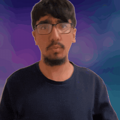 A Man With Glasses And A Beard Waves His Hand In Front Of A Purple Background GIF