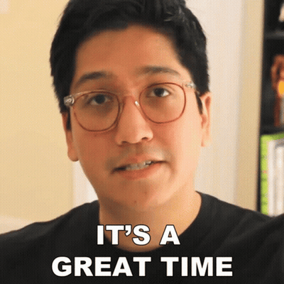 A Man With Glasses And A Black Shirt Says It 'S A Great Time GIF