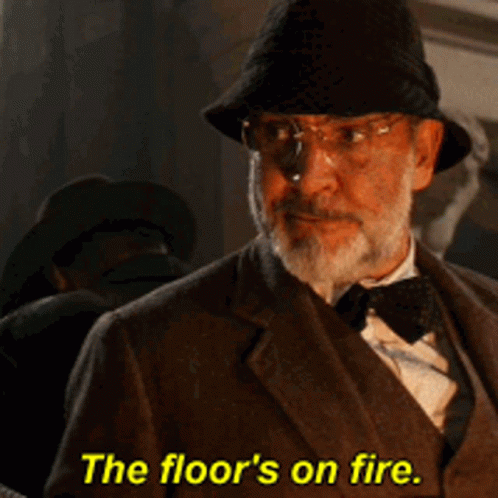 A Man With Glasses And A Hat Says The Floor 'S On Fire GIF