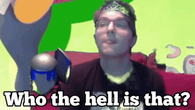 A Man With Glasses And A Headband Is Saying Who The Hell Is That .. GIF