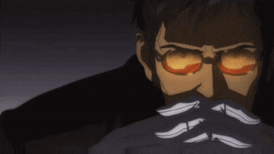 A Man With Glasses And A Mustache Is Covering His Face With His Hands In A Dark Room . GIF