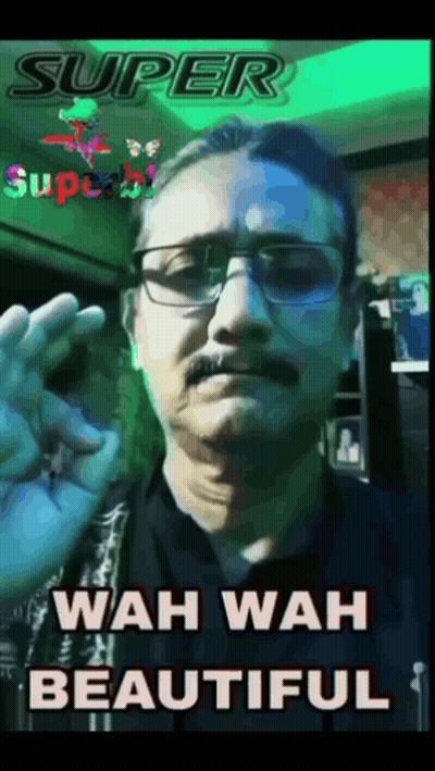 A Man With Glasses And A Mustache Is Giving An Ok Sign GIF