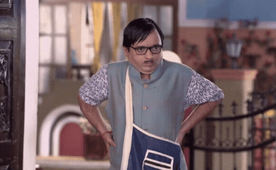 A Man With Glasses And A Mustache Is Holding A Blue Bag That Says ' Id ' On It GIF