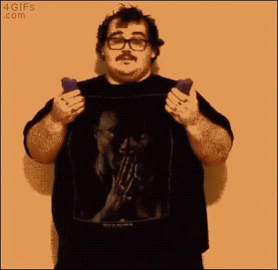 A Man With Glasses And A Mustache Is Holding Two Cell Phones In Front Of A 4Gifs.com Logo GIF