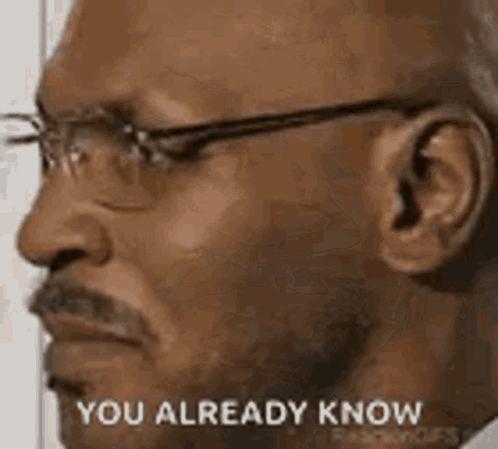A Man With Glasses And A Mustache Is Looking At The Camera And Saying `` You Already Know '' . GIF