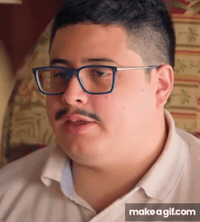 A Man With Glasses And A Mustache Is Making A Funny Face On Make A Gif.com GIF