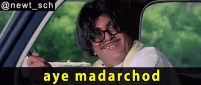 a man with glasses and a mustache is sitting in a car with the words aye madarchod below him