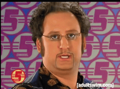 A Man With Glasses And A Mustache Is Standing In Front Of A Pattern Of Circles With The Number 5 On Them GIF