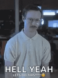 A Man With Glasses And A Mustache Is Standing In Front Of A Sign That Says `` Hell Yeah Lets Do This ! '' GIF