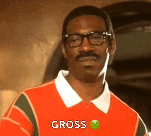 A Man With Glasses And A Mustache Is Wearing A Red Shirt That Says Gross GIF