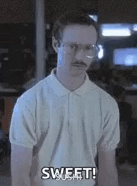 A Man With Glasses And A Mustache Is Wearing A White Shirt And Saying `` Sweet ! '' GIF