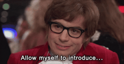 A Man With Glasses And A Red Jacket Says Allow Myself To Introduce ... GIF