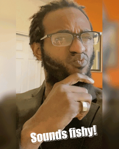 Man With Glasses Saying Sounds Fishy GIF