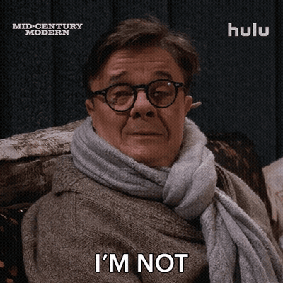 A Man With Glasses And A Scarf Around His Neck Says I 'M Not GIF