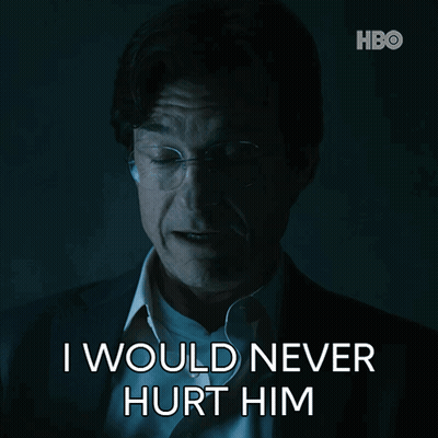 A Man With Glasses And A Suit Says " I Would Never Hurt Him " GIF