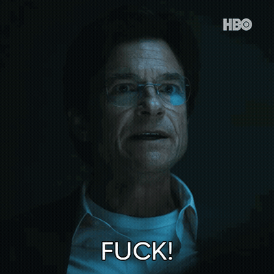 A Man With Glasses And A White Shirt Is Saying Fuck GIF