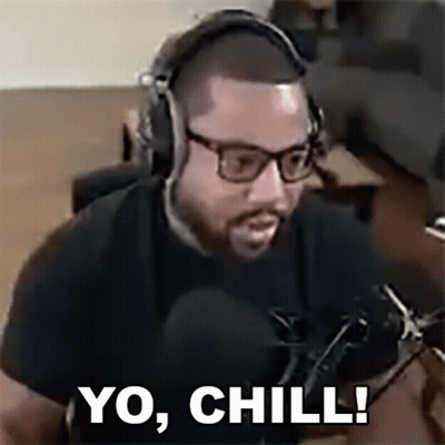 A Man With Glasses And Headphones Is Sitting In Front Of A Microphone And Saying `` Yo , Chill ! '' GIF