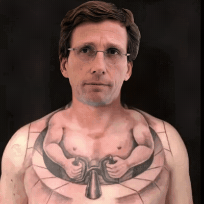 A Man With Glasses Has A Tattoo Of A Man 'S Chest GIF