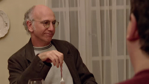 A Man With Glasses Holds A Fork In His Hand GIF