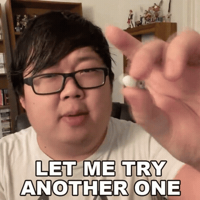 A Man With Glasses Holds A Pill In His Hand With The Words Let Me Try Another One Below Him GIF