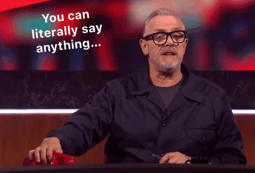 A Man With Glasses Holds A Red Telephone And Says " You Can Literally Say Anything " GIF