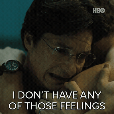 A Man With Glasses Hugging Another Man With The Words " I Don T Have Any Of Those Feelings " Below Him GIF