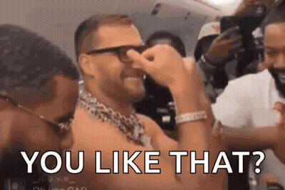 A Man With Glasses Is Covering His Nose With His Hand While Another Man Says You Like That ? GIF