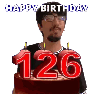 A Man With Glasses Is Holding A Birthday Cake With Candles In The Shape Of The Number 126 Sticker