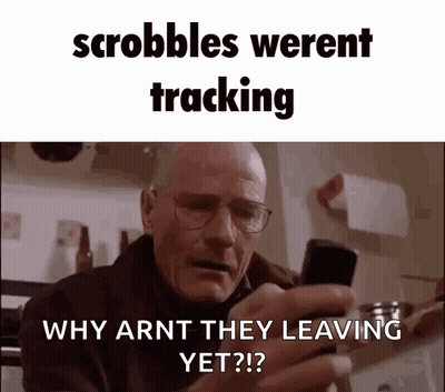 A Man With Glasses Is Holding A Cell Phone In His Hand And Asking Why Arnt They Leaving Yet ? GIF