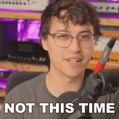 A Man With Glasses Is Holding A Microphone And Saying Not This Time . GIF
