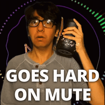 A Man With Glasses Is Holding A Speaker And The Words Goes Hard On Mute Are Above Him GIF