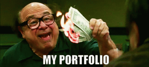 A Man With Glasses Is Holding A Stack Of Money That Is On Fire And Says My Portfolio GIF