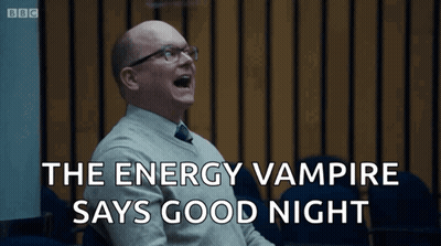 A Man With Glasses Is Laughing With The Words The Energy Vampire Says Good Night Behind Him GIF