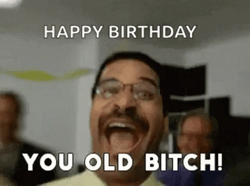 A Man With Glasses Is Making A Funny Face And Saying Happy Birthday You Old Bitch ! GIF