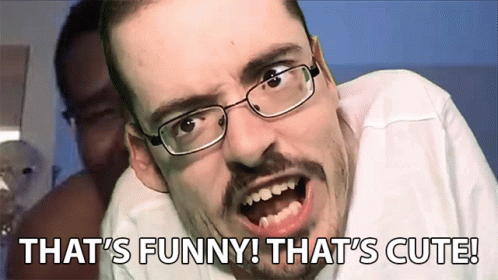 A Man With Glasses Is Making A Funny Face With The Words That 'S Funny That 'S Cute Behind Him GIF