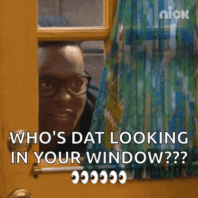 A Man With Glasses Is Peeking Out Of A Window And Says Who 'S Dat Looking In Your Window GIF