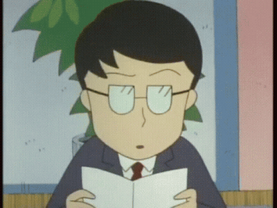 A Man With Glasses Is Reading A Book GIF