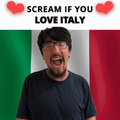 A Man With Glasses Is Screaming In Front Of An Italian Flag GIF