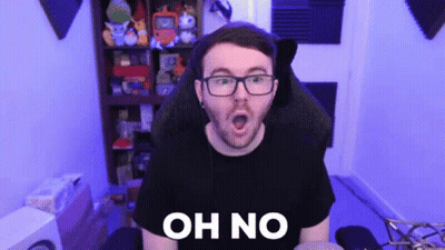 A Man With Glasses Is Sitting In A Chair With His Mouth Open And The Words Oh No Written On His Chest . GIF