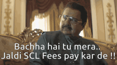 A Man With Glasses Is Sitting On A Couch With The Words Bachha Hai Tu Mera GIF