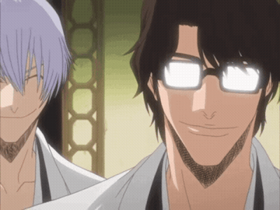 A Man With Glasses Is Smiling Next To Another Man With Purple Hair GIF