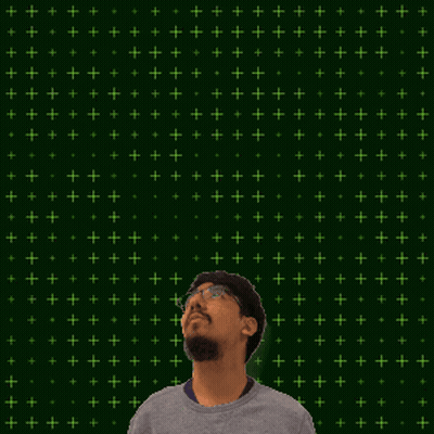 A Man With Glasses Is Standing In Front Of A Green Background With The Number 13 + 3 GIF