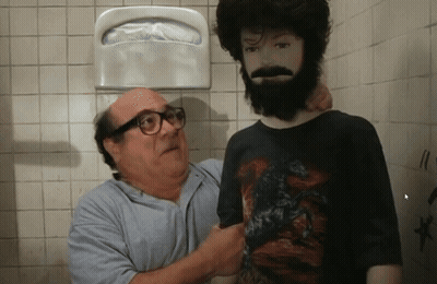A Man With Glasses Is Standing Next To A Man With A Beard GIF