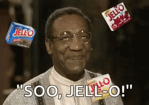 A Man With Glasses Is Surrounded By Boxes Of Jello And Says Soo , Jello-O ! GIF