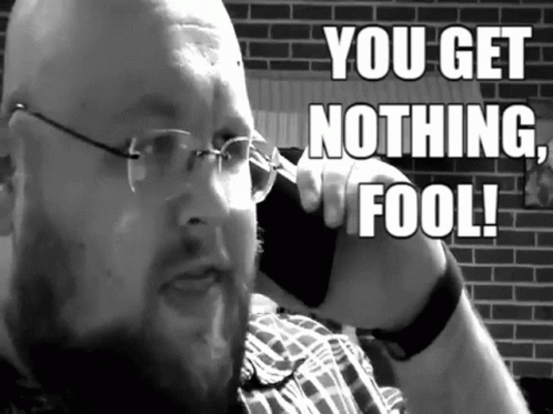 A Man With Glasses Is Talking On A Cell Phone With The Words You Get Nothing Fool Written Above Him GIF